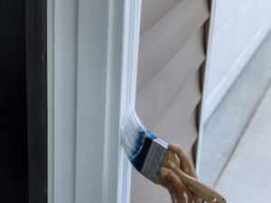paint being applied to a door jamb